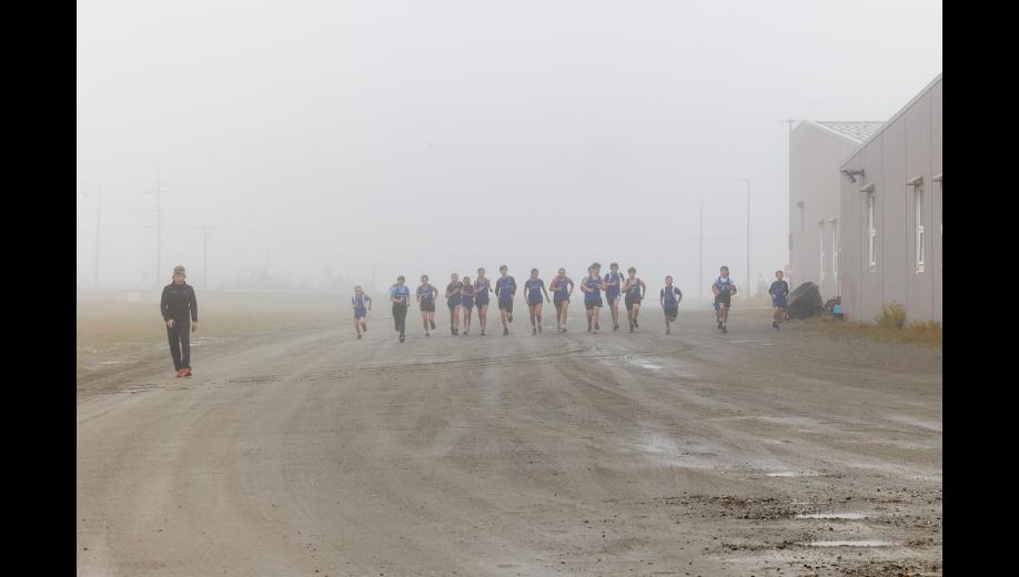 WARMUPS – Members of the Nome-Beltz cross-country running team warm up before the middle school division of the Musk Ox Classic on Saturday, September 5. Photo by Ariana Crockett O'Harra