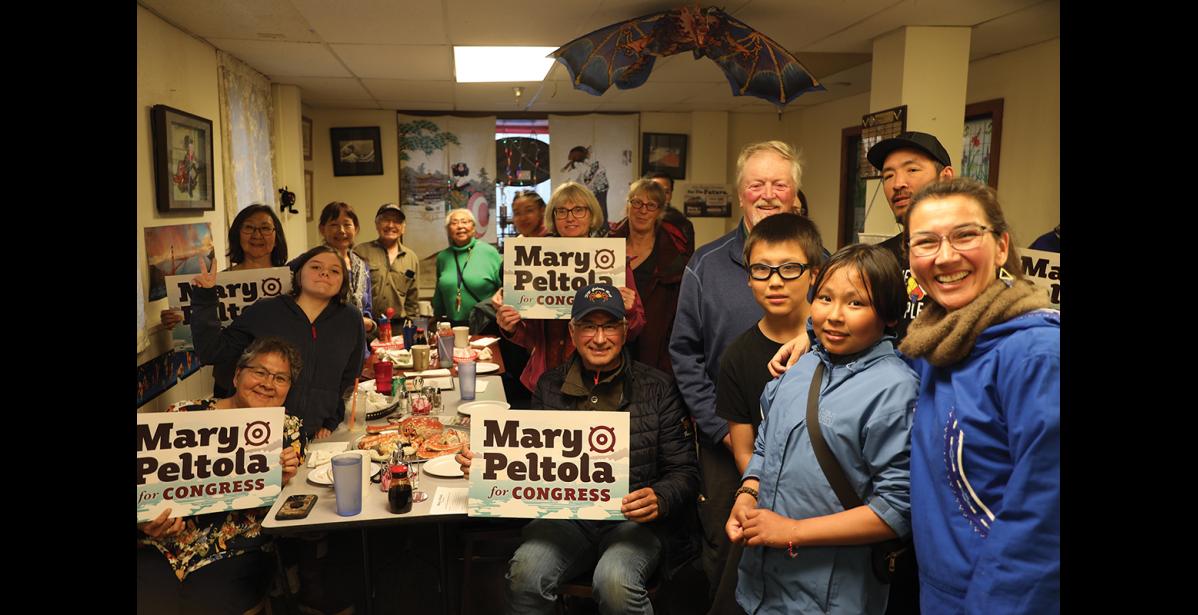 Photo by Colin Warren WE’RE FOR MARY— Nomeites gather to question and support Alaska’s first Native congresswoman Mary Peltola, right, at Milano’s Pizzaria on Tuesday, July 2, 2024.