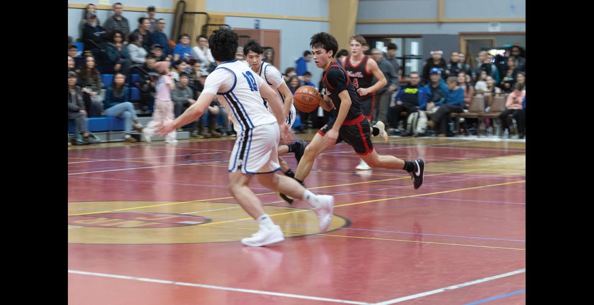 DRIBBLE – Levi Pederson of the Nanooks tries to cut off Ryder Howard of the Wasilla Warriors at the Ruckus at the Rec on Friday, January 23.