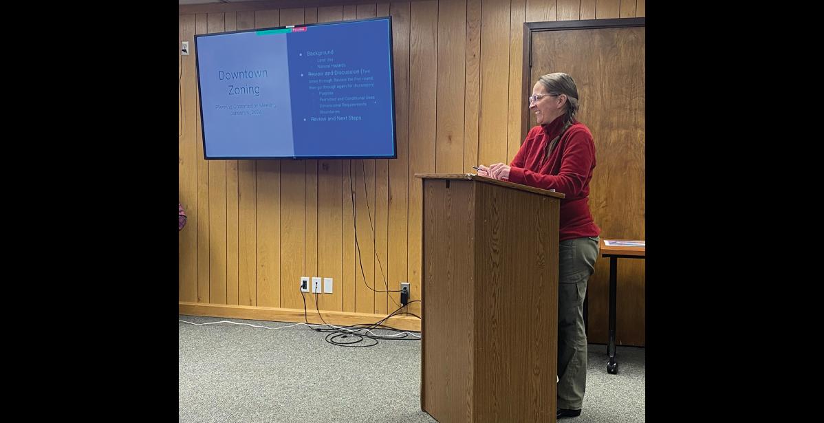 Photo by Anna Lionas ZONING— City Planner Erin Reinders leads a discussion on the rezoning of Front Street during the Planning Commission work session on January 9.