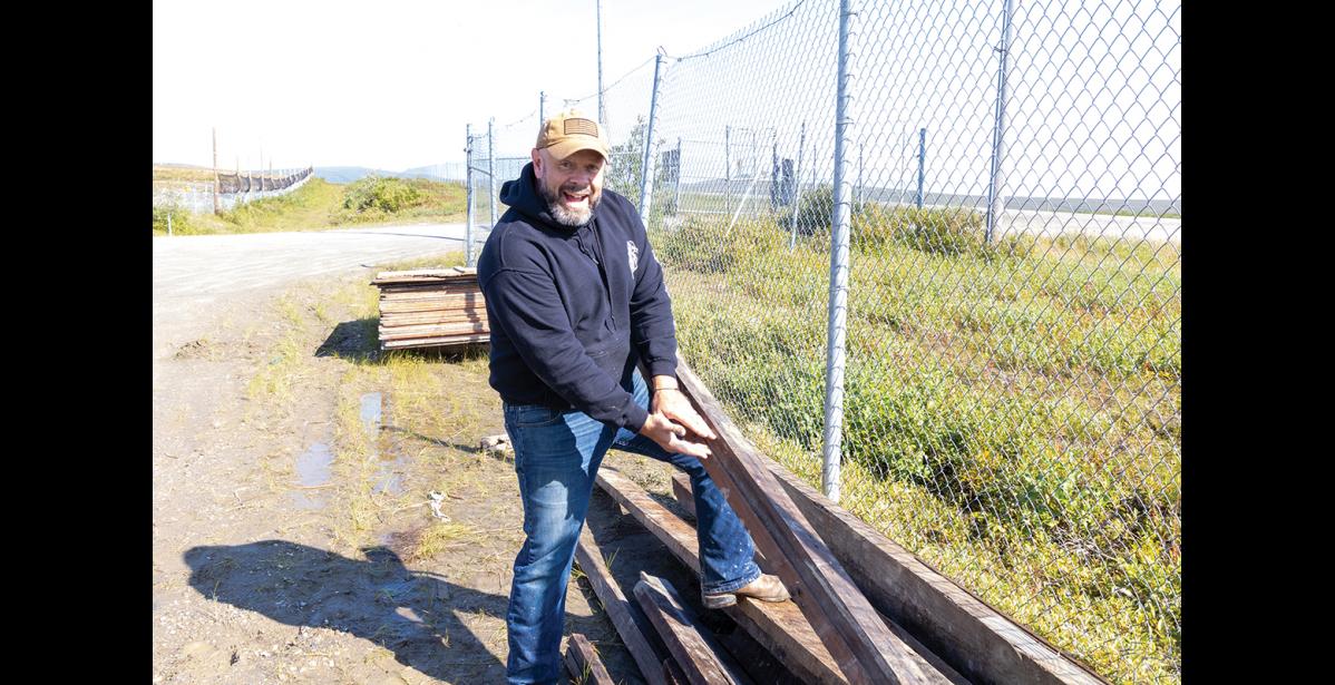 Photo by Anna Lionas EXCITING FIND– Contractor Jonathan Hayes explains how the boards of the deconstructed Seppala House came from a prefabricated home manufacturing company. Hayes and a team of six traveled to Nome in August to deconstruct the old Seppala House and build a new one.