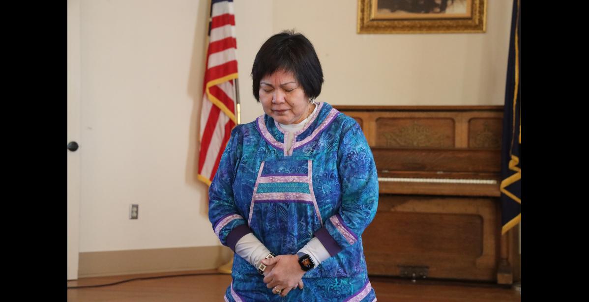 Photo by Laura Robertson Bertha Koweluk with the Methodist Church prays.