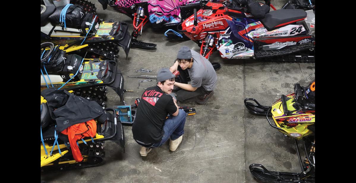 Photo by Laura Robertson Wilson Hoogendorn and Bubba McDaniel plan their wrench day strategy before the timer begins, on Wednesday, in Nome.
