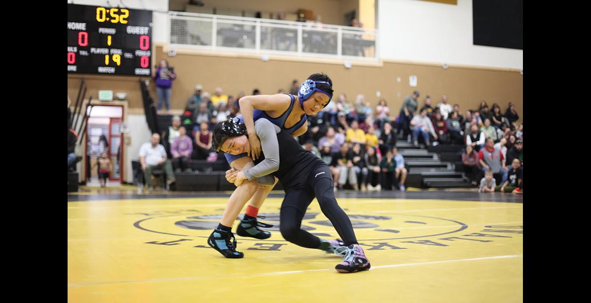 Photo by Violet Jack SHOOT IN— Izabella Martin of Savoonga “shoots in” on Layton James of Gambell in the Junior High “otter” division during their semifinal match on Friday night. James went on to win the division and Martin earned second.