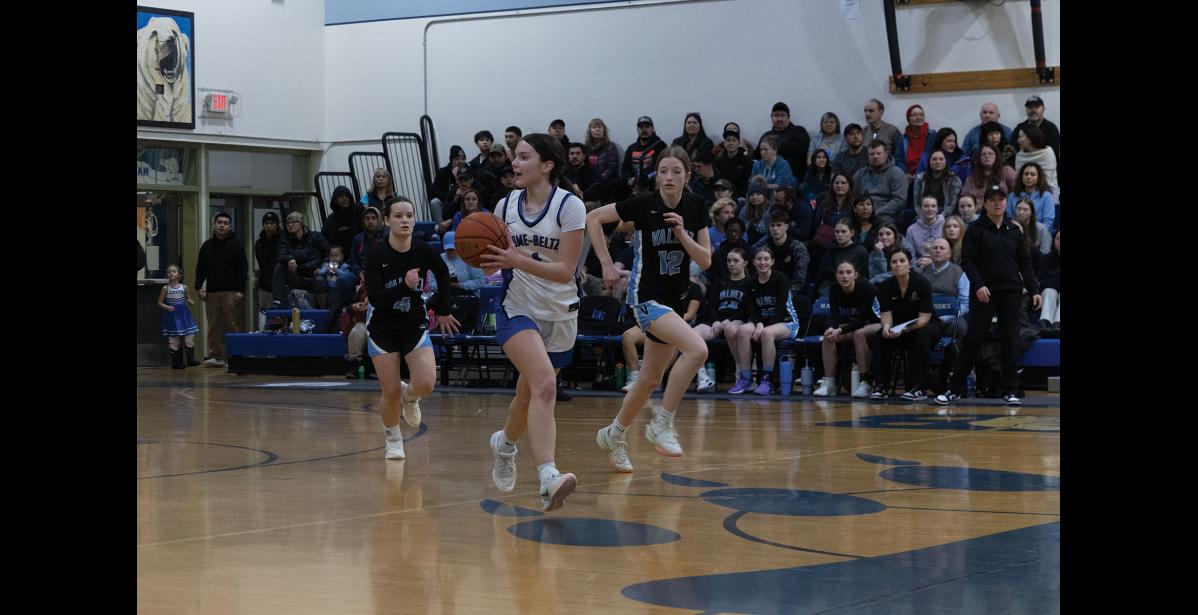 Photo by Ariana Crockett O'Harra GAMEPLAY – Sage Gregg carries the ball up the court during the Lady Nanooks’ Saturday, January 10 game against the Valdez Buccaneers.