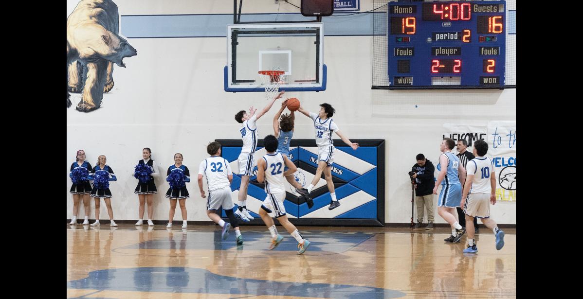 Photo by Ariana Crockett O'Harra MATCHUP – Cohen Booth and Peyton Weyiouanna go for the ball during the Nanooks’ game against the Valdez Buccaneers at the Subway Showdown on Saturday, January 10.