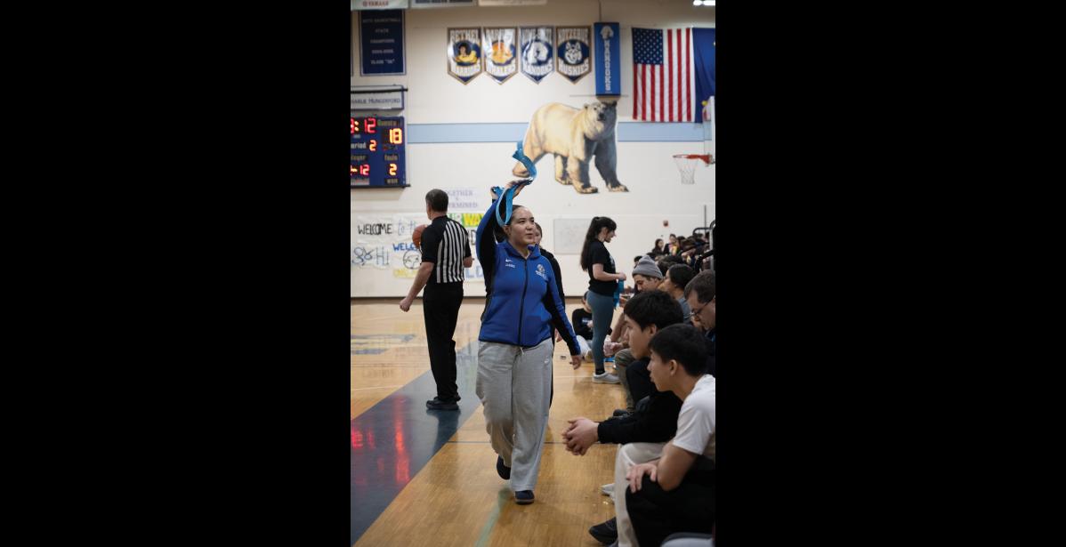 Photo by Ariana Crockett O'Harra RAFFLE TICKETS – Lady Nanooks player Sara James tries to get the crowd to buy raffle tickets during the boys’ game on Saturday, January 10.
