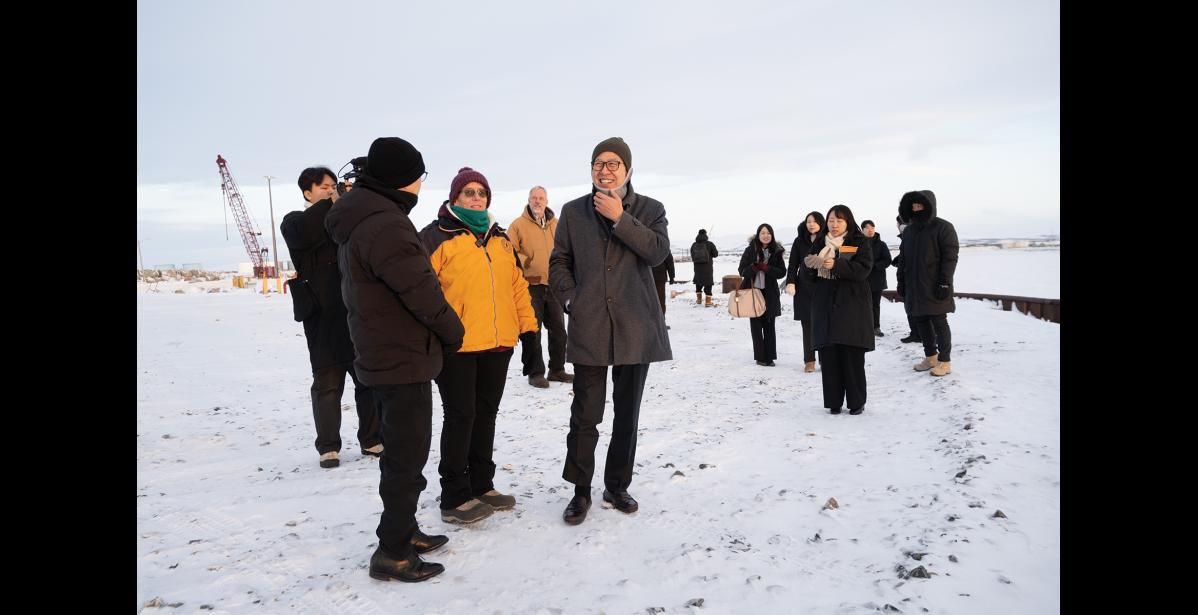 Photo by Ariana Crockett O'Harra ON THE CAUSEWAY— Nome Port Director Joy Baker speaks to Busan Mayor Heong-Joon Park and Head Consul Joongsuk Park of the Korean consulate in Anchorage at the end of the port causeway on Tuesday, January 6.
