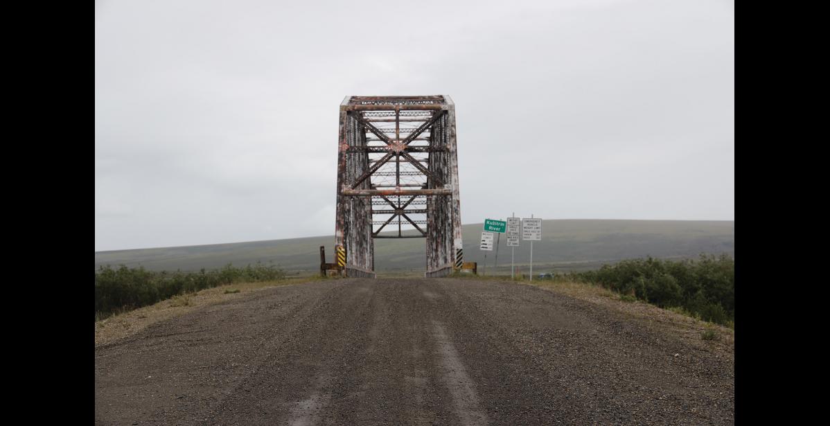 Photo by Colin Warren RECYCLED BRIDGE – Originally a bridge in downtown Fairbanks, the Kuzitrin Bridge was barged down multiple rivers and across the Bering Sea to find it’s new home on the Kougarok Road