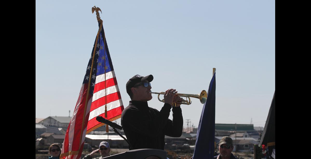 Photo by Diana Haecker Nicholas Reader played Taps.
