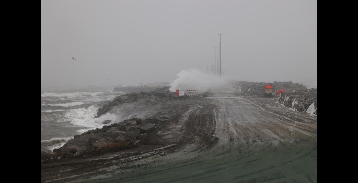 Waves crash over the causeway at the Port of Nome, on Oct. 23. Photo by Diana Haecker