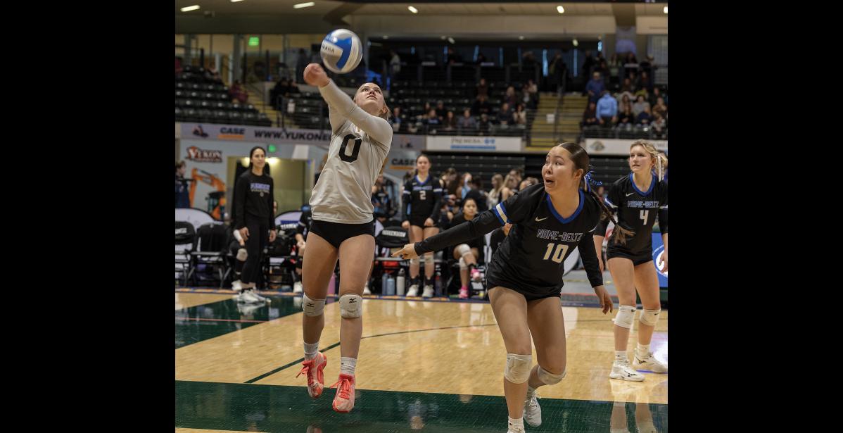 Photo by James Mason THE HEAT OF PLAY - Cassidy Martinson handles a Valdez serve with Roselynn Paniptchuk and Chevy Reader watching.
