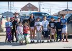 READY FOR CANDY – A group of spectators smile big while awaiting the start of Nome’s Fourth of July Parade.