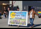 MIDNIGHT SUN— Making a nearly 24-hour appearance was the midnight sun, rewarding Midnight Sun Festival organizers Drew McCann, left, and Briday Green, right, with perfect weather for Saturday’s activities, kicking off with a parade. Also pictured is Brandon Rose.