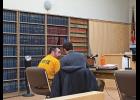 Photo by Sandra Medearis DAY OF RECKONING—Amos Oxereok talks with his attorney James Ferguson at his sentence hearing Feb. 28 in Nome. Oxereok received jail time in a sexual assault case involving 13 school girls in Wales.