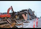 NOW YOU SEE IT—Now you don’t. Charles Reader began to take bites of the burned out Polaris Hotel on Nov. 30. The City solicited accelerated bids on Nov. 28 for emergency abatement to begin ASAP with a deadline of Dec. 11. Reader worked through blizzards and high wind over the weekend. By Tuesday, the remains of the package store, hotel and bar complex had gone to the City’s monofill.