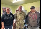 VISITING— U.S. Air Force Lt Col Tim Matson, with SOCNORTH, visited Terry and Bill Crisci in the Wales Native Corporation Building, on Tuesday, August 18. Photo courtesy Lt. Col. Tim Matson