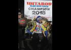 Photo by Diana Haecker 2018 CHAMPION— Joar Leifseth Ulsom of Norway won the Iditarod on March 14, 2018 at 3 a.m. At the champion podium he got a kiss from his lead dog Olive while holding his other lead dog Russeren.