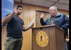 NEW COUNCIL MEMBER— Deputy City Clerk Wali Rana, left, administers the oath of office to newly elected council member Randy Oles, on Tuesday, Oct. 13 at City Hall. Photo by Diana Haecker