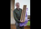 Photo by James Mason CELEBRATED— Dr. Head received a beautiful stethoscope created by Nome artist Joe Kunnuk during an appreciation event at Old St. Joe’s on Saturday, April 7.