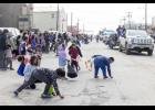 CANDY CANDY – Kids scramble for candy during the Midnight Sun Parade on Saturday, June 20 on Front Street.